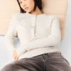 Cardigan à boutons décoratifs en forme de nœud