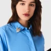 Chemise avec bijoux amovibles Chemise avec bijoux amovibles