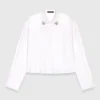 Chemise courte avec détail bijou