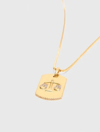 Collier avec plaque représentant le signe du zodiaque