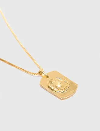 Collier avec plaque représentant le signe du zodiaque