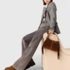 Jean à jambes larges avec ceinture à maillons Jean à jambes larges avec ceinture à maillons