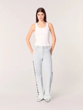 Jean à jambes larges et découpes ornées de strass