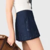 Jupe-short en denim brodée à effet superposé Jupe-short en denim brodée à effet superposé