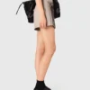 Jupe-short plissée à strass Jupe-short plissée à strass