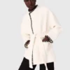 Manteau doublé avec ruban contrasté Manteau doublé avec ruban contrasté