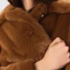 Manteau mi-long en fausse fourrure