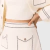 Mini-jupe en maille surpiquée Mini-jupe en maille surpiquée