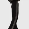 Pantalon avec bande en strass Pantalon avec bande en strass