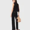 Pantalon en maille ornée de bijoux