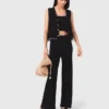 Pantalon en maille ornée de bijoux