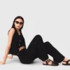 Pantalon en maille ornée de bijoux