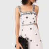 Robe longue à découpes brodées