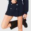 Short en tweed avec ceinture contrastée