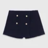 Short en tweed avec ceinture contrastée